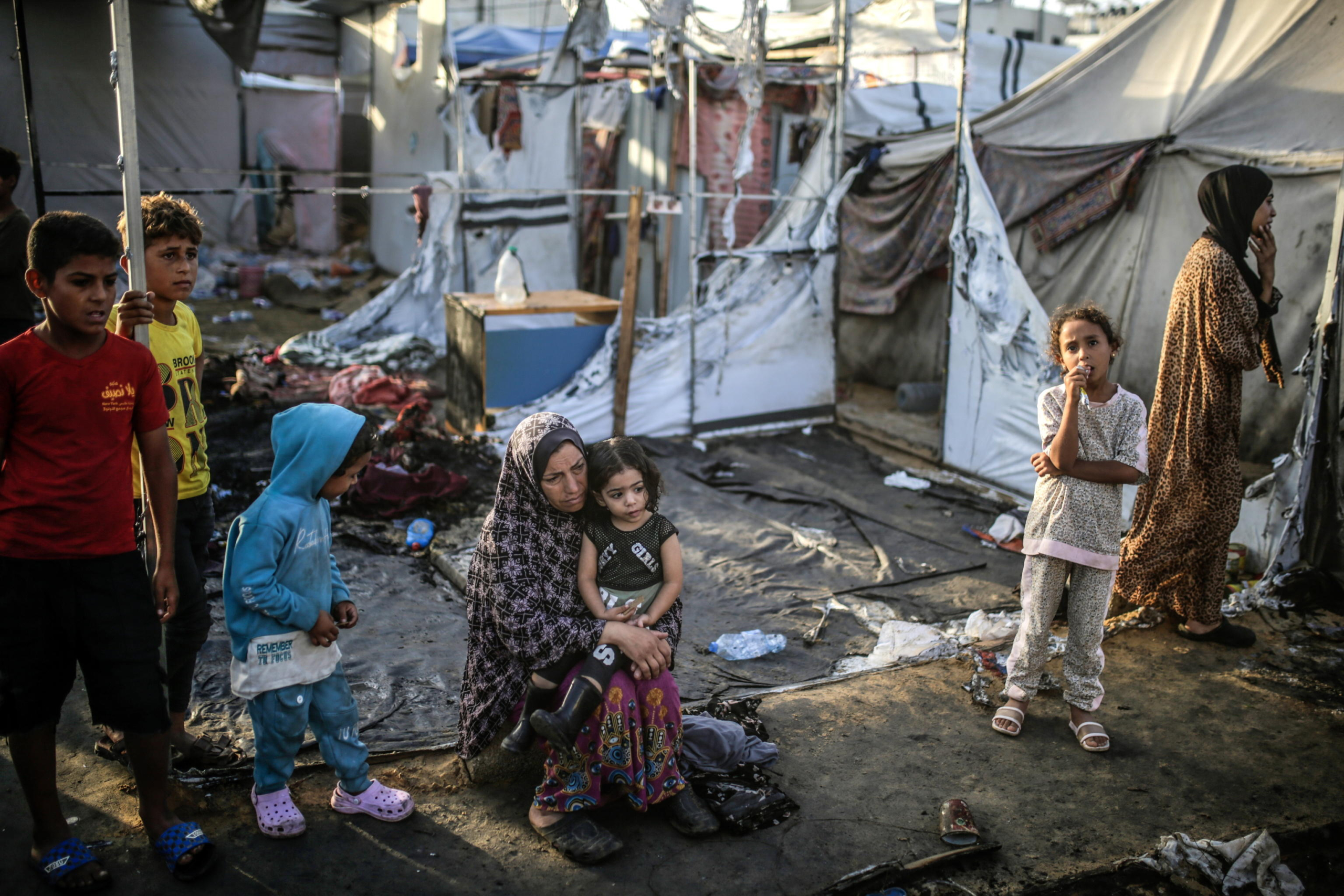 epa11657926 Palestinians inspect destroyed makeshift tents at a camp for internally displaced people on the premises of al-Aqsa Hospital, after the area was hit by an Israeli air strike, in Deir al Balah, central Gaza Strip, 14 October 2024. According to the Palestinian Ministry of Health, four people were killed as a result of the strike on al-Asqa hospital, and several dozens were wounded. More than 42,200 Palestinians and over 1,400 Israelis have been killed, according to the Palestinian Health Ministry and the Israel Defense Forces (IDF), since Hamas militants launched an attack against Israel from the Gaza Strip on 07 October 2023, and the Israeli operations in Gaza and the West Bank which followed it.  EPA/MOHAMMED SABER