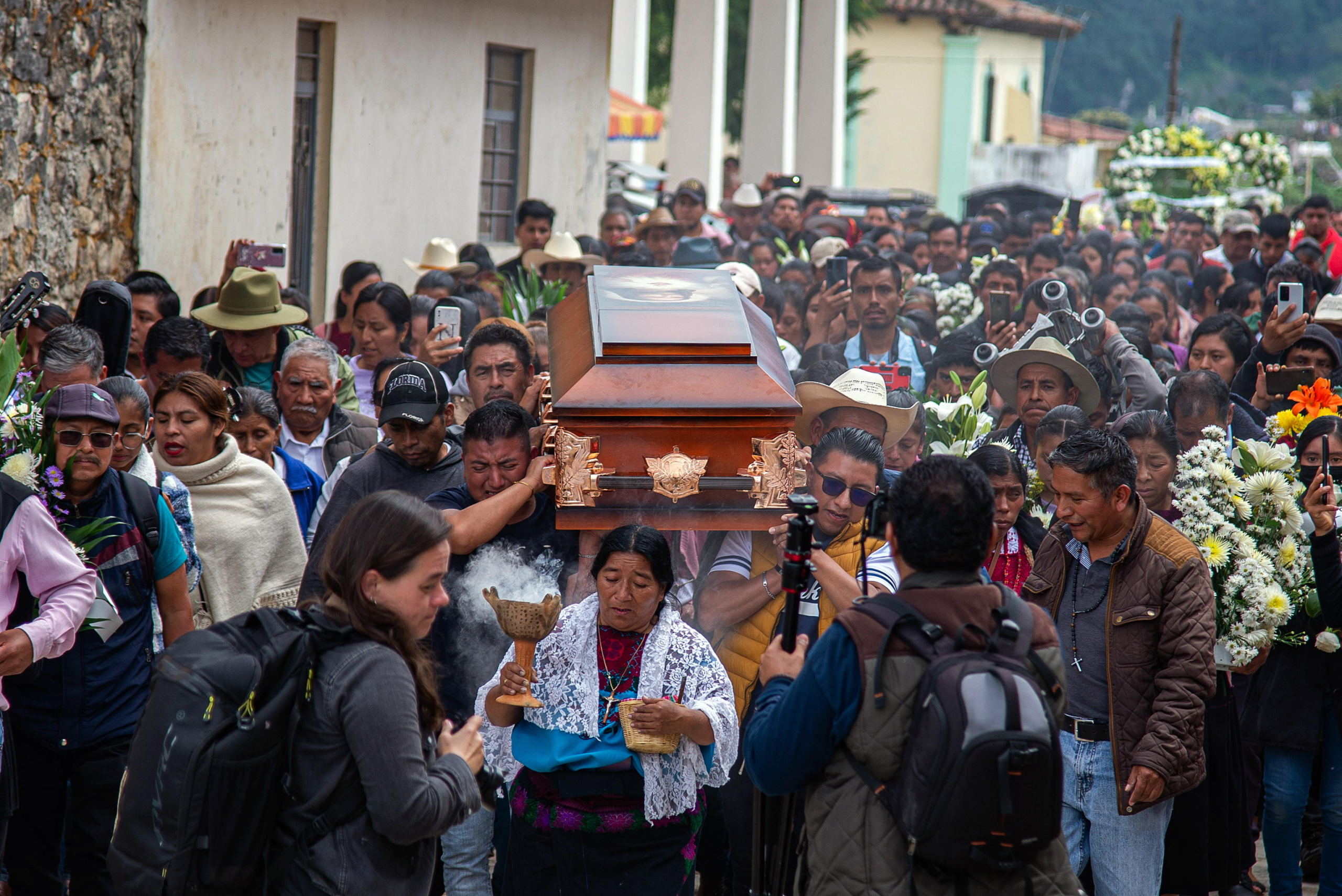 epaselect epa11673987 Hundreds of people participate in a mass for the murdered priest Marcelo Perez, in San Andres Larrainzar, Chiapas state, Mexico, 21 October 2024. Civil organizations, indigenous catechists and priests participated in the funeral mass for Father Marcelo Perez, who was shot by a gunman after leaving a church service. According to a statement by the Jesuits, Father Perez was a vocal opponent of organized criminal groups and supporter of indigeonous and worker's rights.  EPA/Carlos López