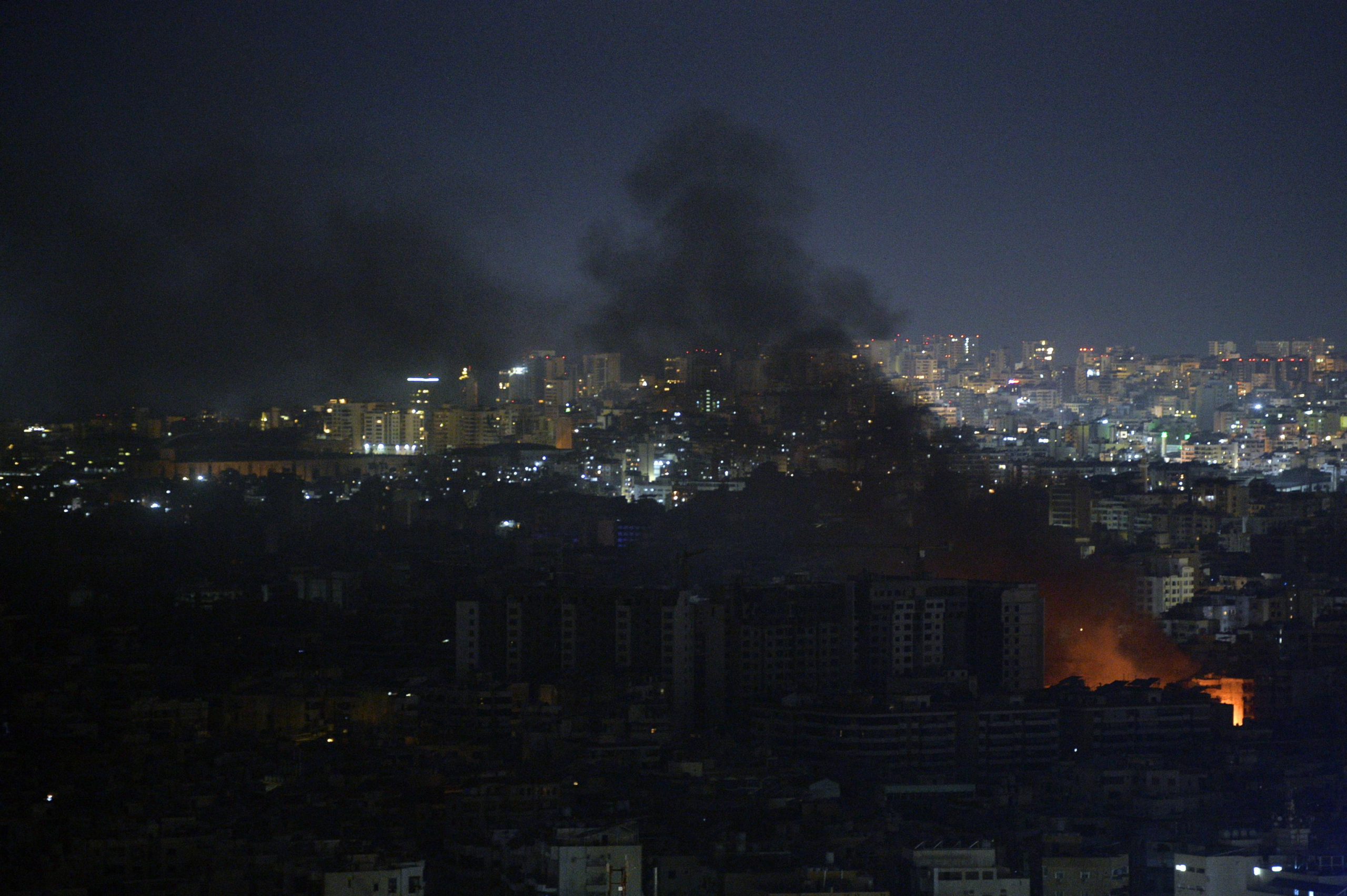 epa11681814 Smoke rises from buildings as a result of Israeli airstrikes at Dahieh in the southern suburb of Beirut, Lebanon, late 24 October 2024. Israeli airstrikes hit Dahieh in the southern suburb of Beirut after the Israeli Army issued warnings to evacuate the buildings. According to the Lebanese Ministry of Health, more than 2,500 people have been killed and over 12,000 others have been injured in Lebanon since the start of recent escalations of hostilities.  EPA/WAEL HAMZEH