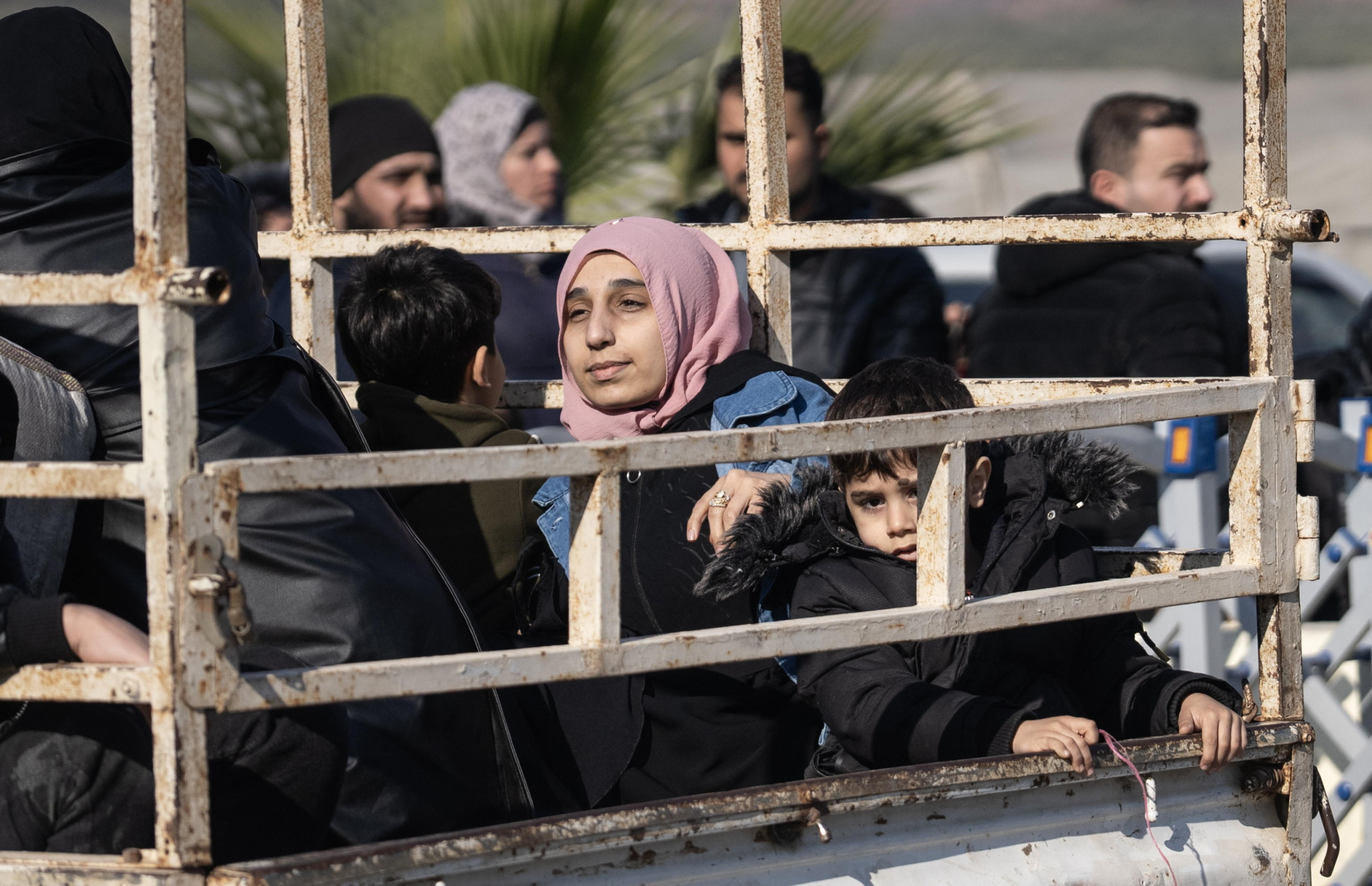 epa11766503 Syrians wait to cross into Syria from Turkey at the Cilvegozu Border Gate in Reyhanli district of Hatay, Turkey, 09 December 2024.  On 09 December 2024, the Political Affairs Department of the Syrian Salvation government called for all refugees outside Syria to return. Syrian rebels entered Damascus on 08 December 2024 and announced in a televised statement the 'Liberation of the city of Damascus and the overthrow of Bashar al-Assad,' as well as the release of all the prisoners. The rebels also urged the Syrian armed forces to leave Syrian public institutions, which will stay under the control of the outgoing Syrian prime minister until the official handover ceremony.  EPA/KAZIM KIZIL