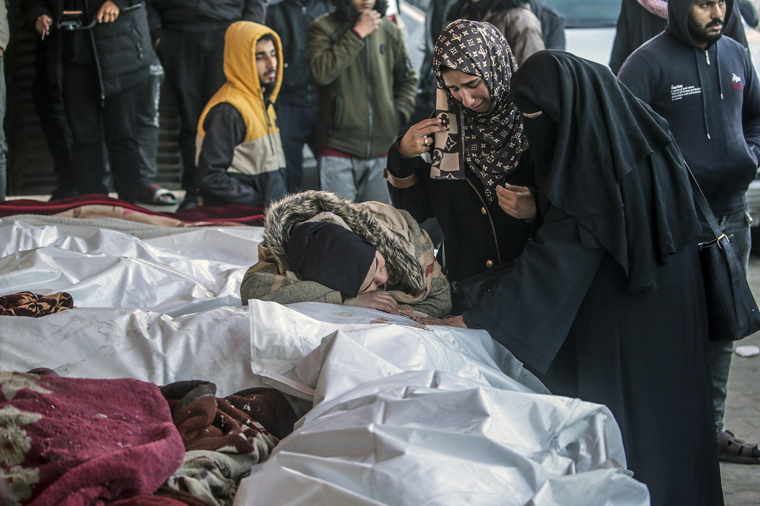 epa11803172 Palestinian women mourn during the funeral of their relatives killed in Israeli air strikes, in Al Aqsa Martyrs Hospital, in Deir Al Balah, central Gaza Strip, 03 January 2025. According to reports from the Ministry of Health in Gaza, more than 29 people were killed following Israeli air strikes in the refugee camps of central Gaza Strip. More than 45,500 Palestinians and over 1,400 Israelis have been killed, according to the Palestinian Health Ministry and the Israeli Army, since Hamas militants launched an attack against Israel from the Gaza Strip on 07 October 2023 and the Israeli operations in Gaza and the West Bank that followed it.  EPA/MOHAMMED SABER