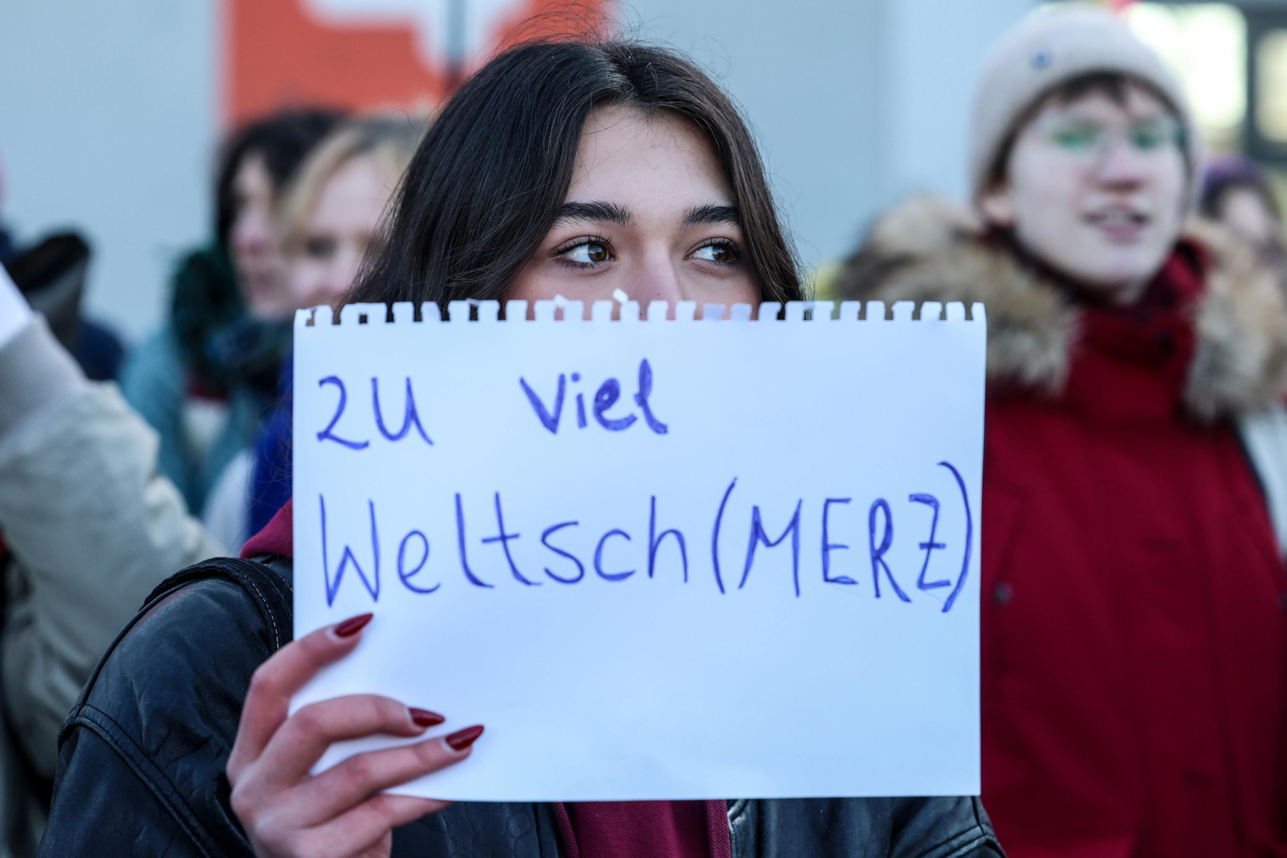 epa11872366 A protester holds a sign during a protest against cooperation with the Alternative for Germany 'AfD' party ahead of the Christian Democratic Union 'CDU' federal party conference in Berlin, Germany, 03 February 2025. People gathered to protest against the CDU's cooperation with the AfD party after the CDU's motion in the Bundestag won a majority with the help of AfD votes.  EPA/Filip Singer