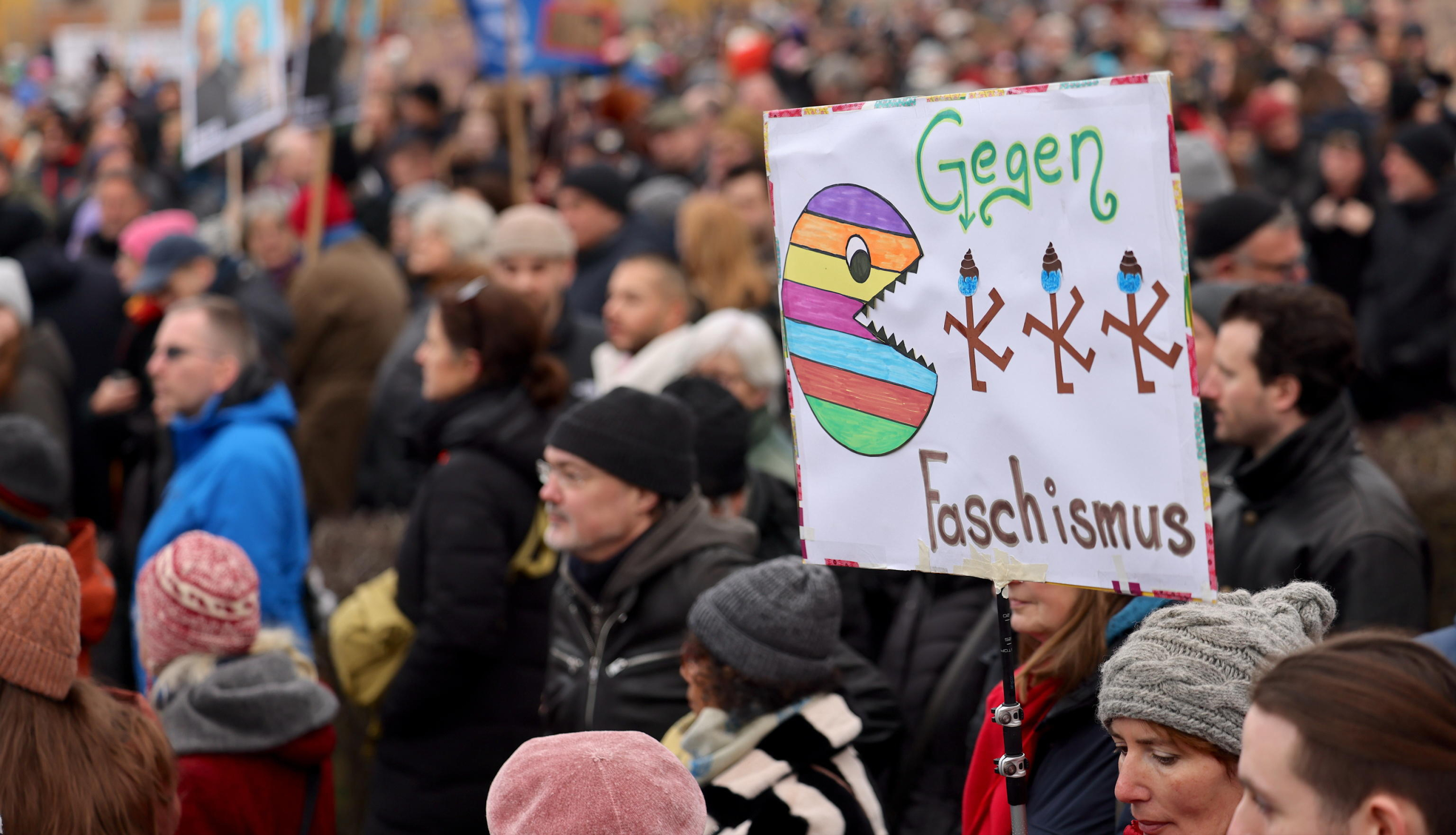 epa11870113 Protesters gather during a rally in front of the Reichstag building in Berlin, Germany, 02 February 2025. People gathered to protest against the Christian Democratic Union's (CDU) cooperation with the far-right Alternative for Germany (AfD) party, after the CDU's motion in the Budestag won a majority with the help of AfD votes. This is a novelty, as the CDU wanted to maintain a so-called 