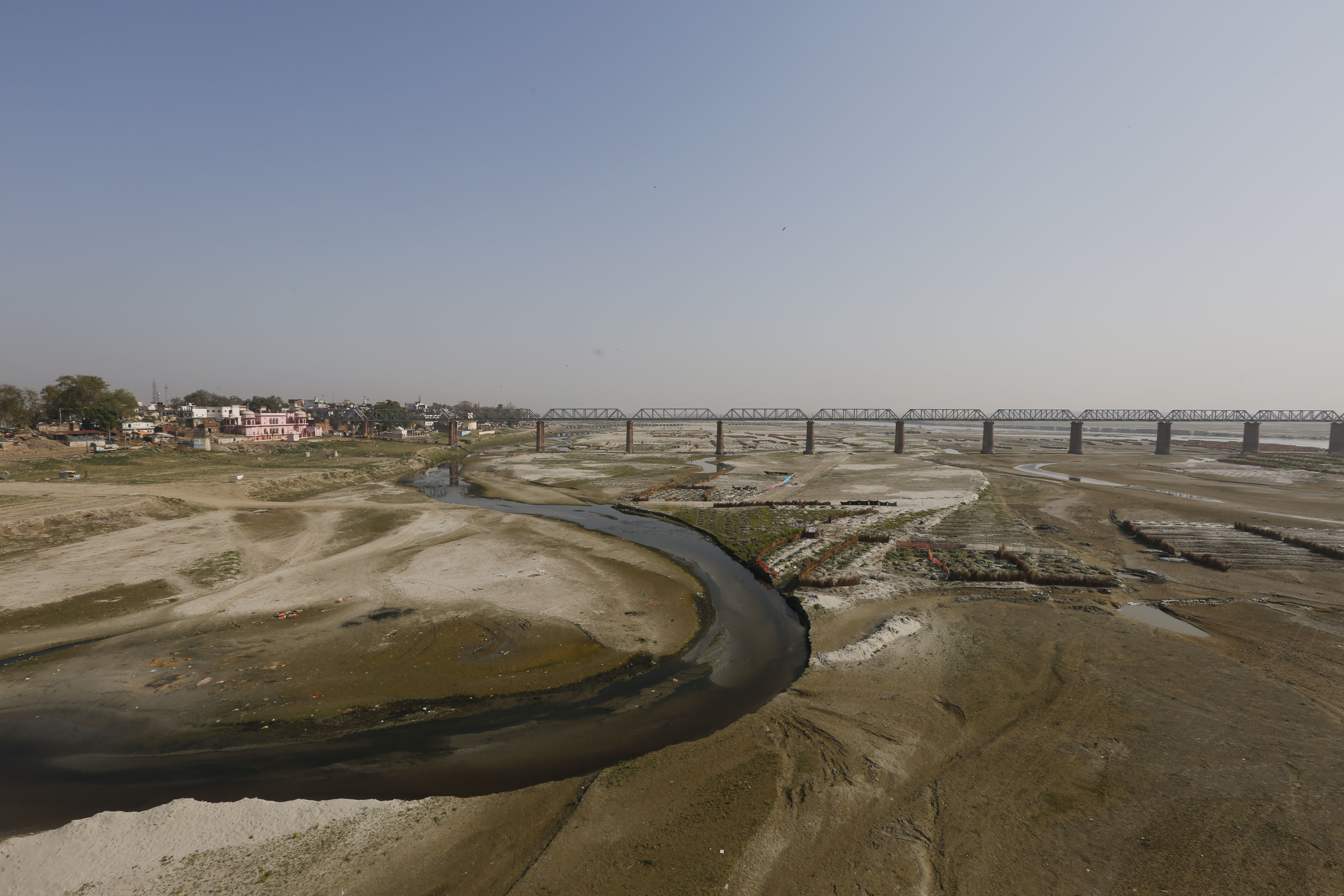 A view of a portion of the Ganges River where water levels have receded on World Water Day in Allahabad, India, Wednesday, March 22, 2017.  Two of India's most iconic rivers, the Ganges and the Yamuna, considered sacred by nearly a billion Hindus in the country, have been given the status of living entities to save them from further harm caused by widespread pollution. (AP Photo/Rajesh Kumar Singh)