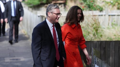 epa11456395 Labour Party leader Sir Keir Starmer (L) arrives with his wife Victoria Starmer at a polling station to vote during the British General Election in London, Britain, 04 July 2024. Britons are heading to the polls to elect new members of Parliament following the call by Britain's Prime Minister Sunak for a snap election.  EPA/NEIL HALL