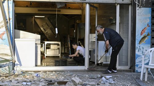 epa11639146 People clean a shop from debris following an Israeli airstrike in Beirut's Bachoura neighborhood, Lebanon, 03 October 2024. Lebanese officials reported that an Israeli airstrike on a building in central Beirut resulted in at least five deaths and eight injuries.  EPA/WAEL HAMZEH