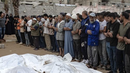 epa11659963 Palestinians, including victims' relatives, pray next to the bodies of members of the Abu Taima family, killed in an Israeli air strike, at the Khan Younis refugee camp, southern Gaza Strip, 15 October 2024. According to Nasser Hospital, at least 10 members of an extended family were killed in an Israeli airstrike on their home in Bani Suhaila, east of Khan Younis early on 15 October. More than 42,200 Palestinians and over 1,400 Israelis have been killed, according to the Palestinian Health Ministry and the Israeli Army, Tsahal, since Hamas militants launched an attack against Israel from the Gaza Strip on 07 October 2023, and the Israeli operations in Gaza and the West Bank which followed it.  EPA/HAITHAM IMAD