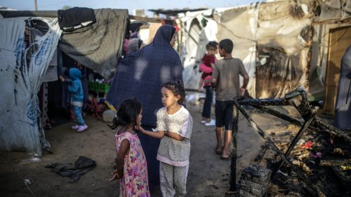 epa11657927 Palestinians inspect destroyed makeshift tents at a camp for internally displaced people on the premises of al-Aqsa Hospital, after the area was hit by an Israeli air strike, in Deir al Balah, central Gaza Strip, 14 October 2024. According to the Palestinian Ministry of Health, four people were killed as a result of the strike on al-Asqa hospital, and several dozens were wounded. More than 42,200 Palestinians and over 1,400 Israelis have been killed, according to the Palestinian Health Ministry and the Israel Defense Forces (IDF), since Hamas militants launched an attack against Israel from the Gaza Strip on 07 October 2023, and the Israeli operations in Gaza and the West Bank which followed it.  EPA/MOHAMMED SABER