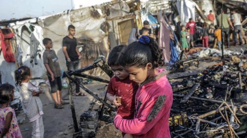 epa11657929 Palestinians inspect destroyed makeshift tents at a camp for internally displaced people on the premises of al-Aqsa Hospital, after the area was hit by an Israeli air strike, in Deir al Balah, central Gaza Strip, 14 October 2024. According to the Palestinian Ministry of Health, four people were killed as a result of the strike on al-Asqa hospital, and several dozens were wounded. More than 42,200 Palestinians and over 1,400 Israelis have been killed, according to the Palestinian Health Ministry and the Israel Defense Forces (IDF), since Hamas militants launched an attack against Israel from the Gaza Strip on 07 October 2023, and the Israeli operations in Gaza and the West Bank which followed it.  EPA/MOHAMMED SABER