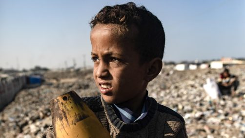 epaselect epa11700530 A Palestinian boy holds an Israeli artillery shell found while sorting through the garbage at a landfill, amid a shortage of cooking gas and fuel, at the Khan Younis refugee camp, in the southern Gaza Strip, 04 November 2024. A United Nations Office for the Coordination of Humanitarian Affairs (OCHA) assessment carried out across some IDP camps in Gaza in May 2024 pointed to 'makeshift dwellings being made of blankets, nylon, and foraged materials. With no electricity, and cooking gas and wood being too expensive, families were resorting to burning trash and plastic to cook. According to the UN, at least 1.9 million people across the Gaza Strip are internally displaced. Since October 2023, only about 11 percent of the Gaza Strip has not been placed under Israeli-issued evacuation orders, the UN aid coordination office OCHA said.  EPA/HAITHAM IMAD