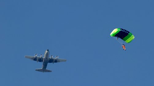 epa11786577 A Taiwanese paratrooper jumps from a C-130 plane during a live training session in Pingtung city, Taiwan, 20 December 2024. According to a 18 December report published by the United States Department of Defense (DoD), in 2023, China continued to increase diplomatic, political, and military pressure against Taiwan.  EPA/RITCHIE B. TONGO