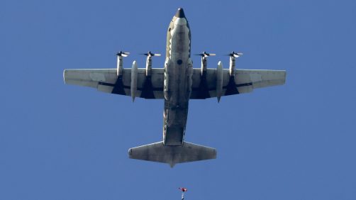 epa11786581 A Taiwanese paratrooper jumps from a C-130 plane during a live training session in Pingtung city, Taiwan, 20 December 2024. According to a 18 December report published by the United States Department of Defense (DoD), China continued to increase diplomatic, political, and military pressure against Taiwan in 2023.  EPA/RITCHIE B. TONGO