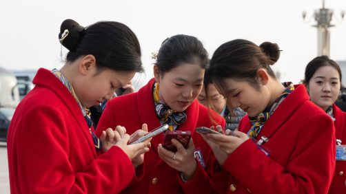 epa11952995 Staff members look at their phones during the Closing Session of the Chinese People's Political Consultative Conference (CPPCC) at the Great Hall of the People in Beijing, China, 10 March 2025. China holds two major annual political meetings: the National People's Congress (NPC) and the Chinese People's Political Consultative Conference (CPPCC), which run alongside each other and are collectively known as the 'Lianghui' or 'Two Sessions.  EPA/JESSICA LEE